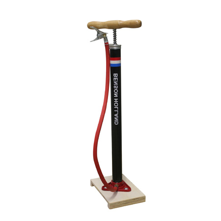 Black bicycle pump standing with wooden handle