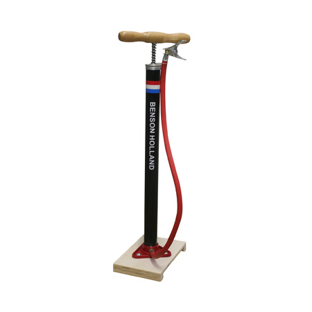 Black bicycle pump standing with wooden handle