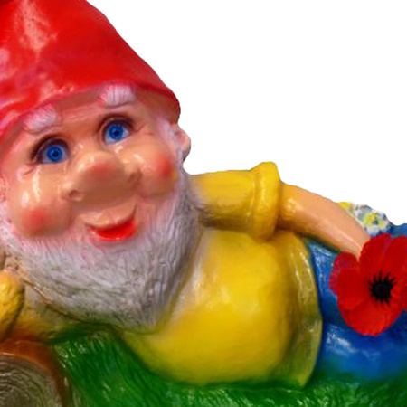 Garden gnome lying on grass 30 cm